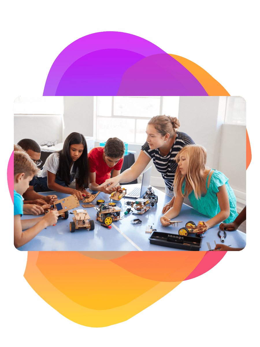 A teacher with a group of young people doing a STEM lesson - Bee Digital marketing agency